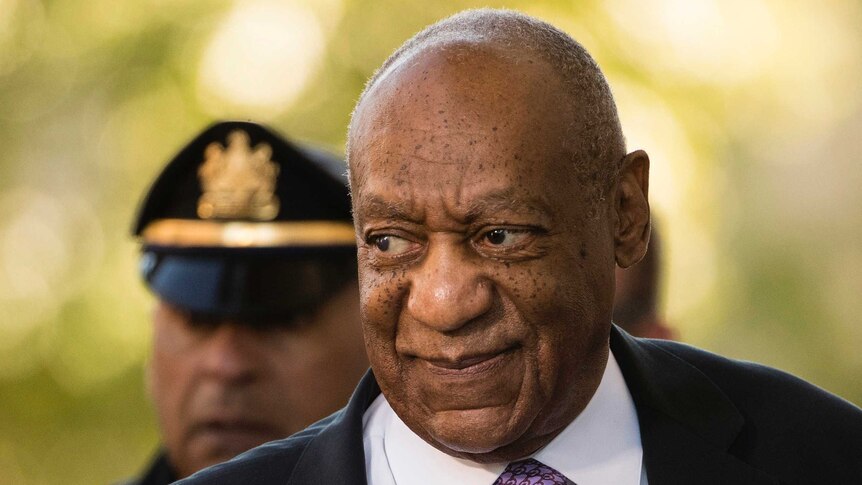 A closeup photo of Bill Cosby looking to the side as he arrives at court.