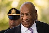 A closeup photo of Bill Cosby looking to the side as he arrives at court.