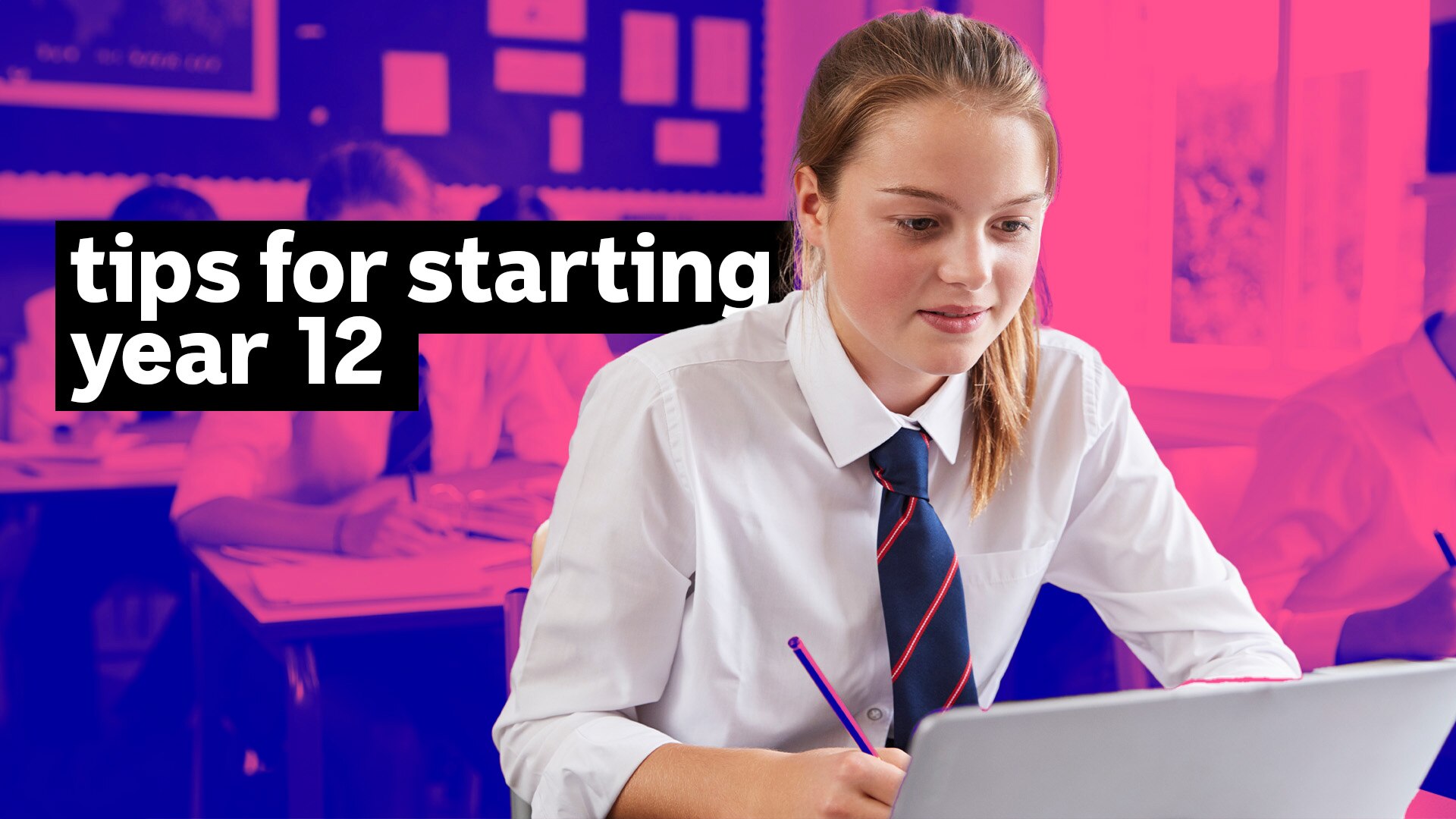 A student looks at a laptop computer while writing with a pencil.