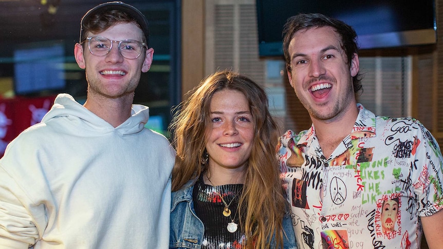 Maggie Rogers in the triple j studios, with Breakfast hosts Ben Harvey and Liam Stapleton