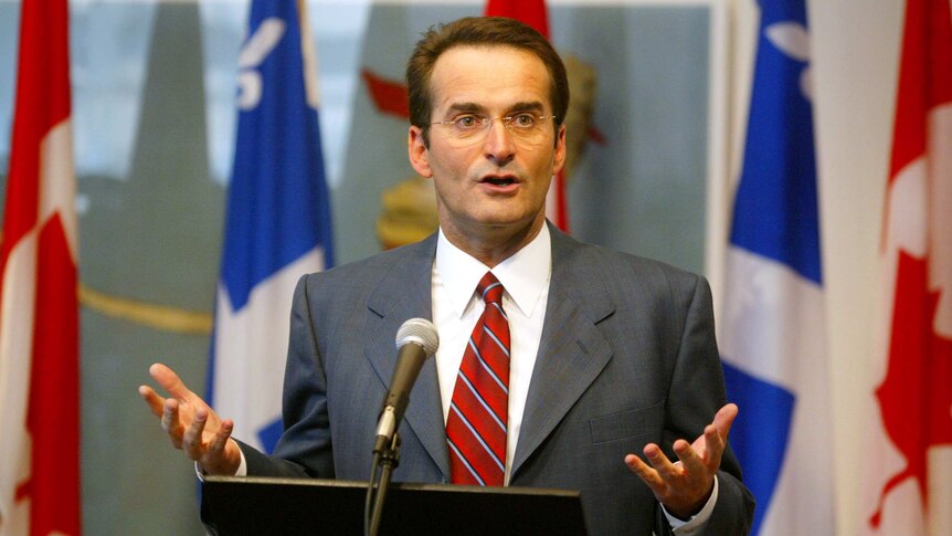 Jean Lapierre speaking at a news conference