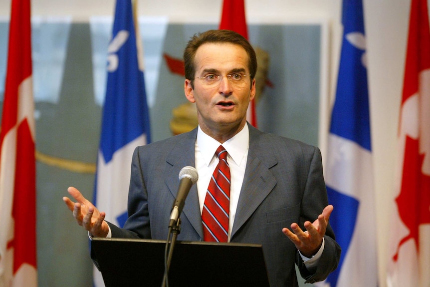 Jean Lapierre speaking at a news conference