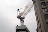 Crane on fire on a building site in Ultimo