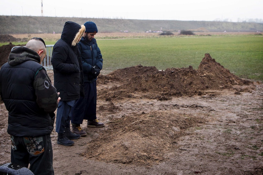 Mourners at unmarked grave of Copenhagen gunman Omar Abdel Hamid El-Hussein