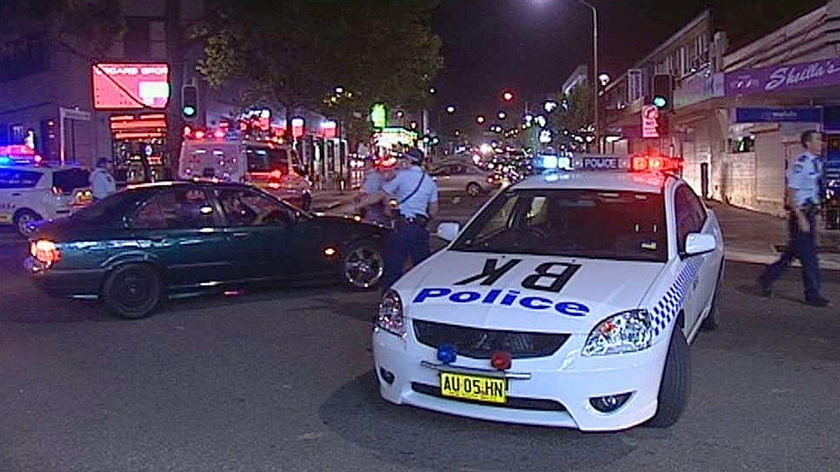 Police at the scene of a brawl outside a Bankstown bar, in which two people were stabbed to death.