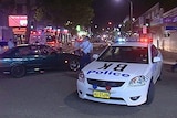 Police at the scene of a brawl outside a Bankstown bar, in which two people were stabbed to death.