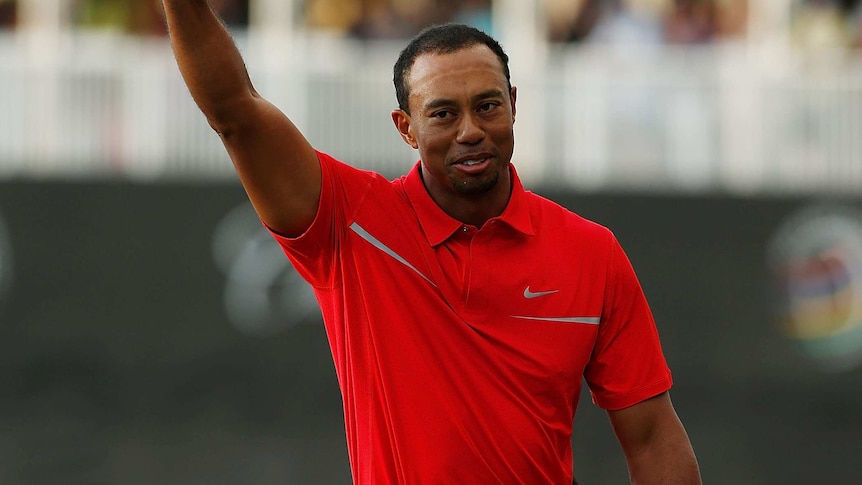 76th PGA win ... Tiger Woods celebrates after his two-stroke victory in Doral.