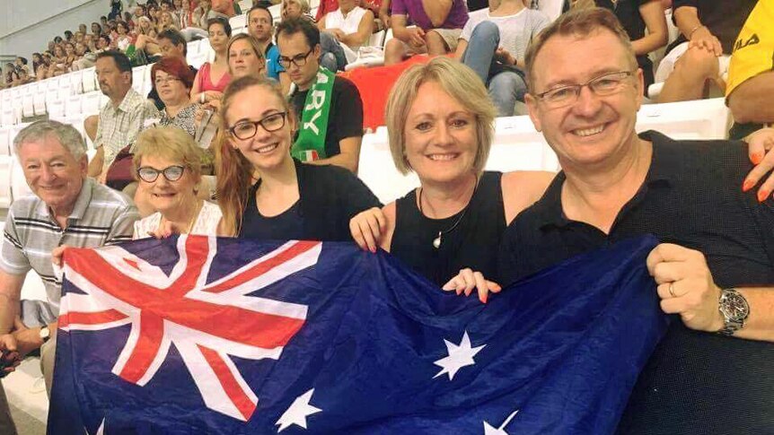 Titmus family hold Australian flag