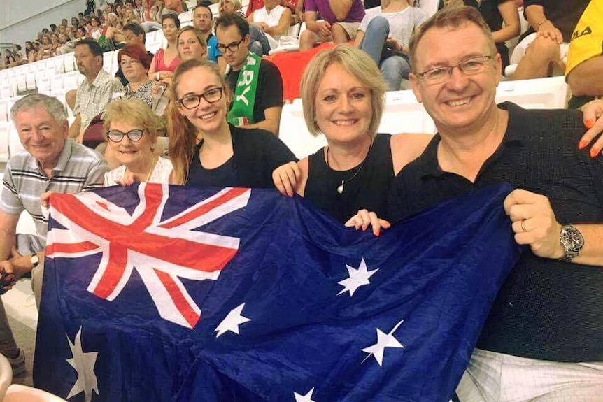 Titmus family hold Australian flag