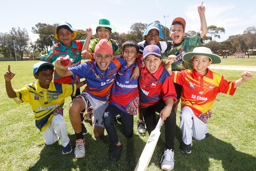A group of junior cricketers pose before a match