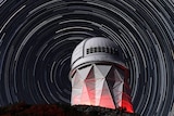 An observatory with star trails.