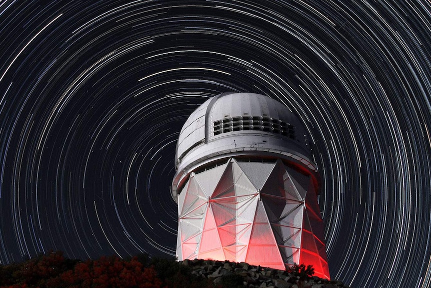 An observatory with star trails.