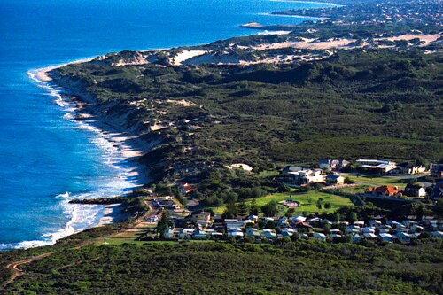 An aerial shot of Burns Beach showing housing and the coastline.