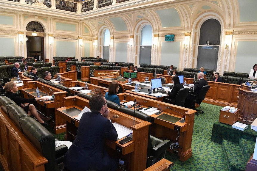 A reduced number of members due to social distancing measures is seen during a sitting of the Queensland Parliament in Brisbane.