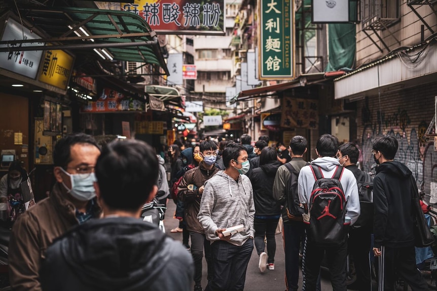 Pedestrians walk on the street of Taiwan. 