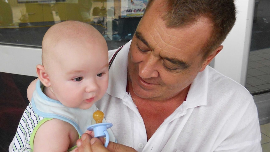 John Sandeman with his grandson Mason Parker who died in 2011 at 16 months of age.
