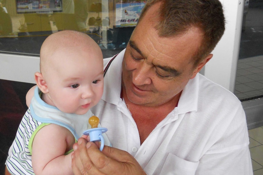 John Sandeman with his grandson Mason Parker who died in 2011 at 16 months of age.