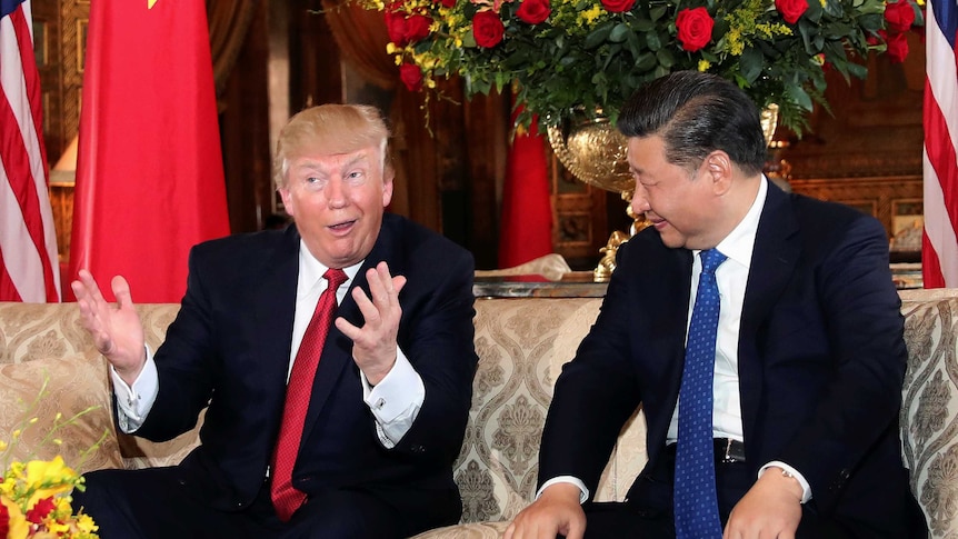 US President Donald Trump interacts with Chinese President Xi Jinping at Mar-a-Lago state in Palm Beach, Florida.