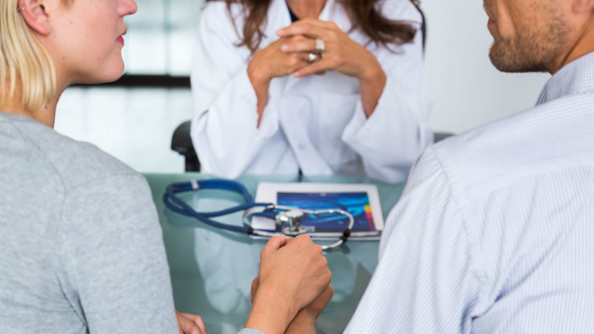 A couple having a consultation with a doctor