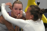 A crying Markéta Vondroušová is hugged by doubles partner Barbora Strýcová after she withdrew from their US Open doubles match.