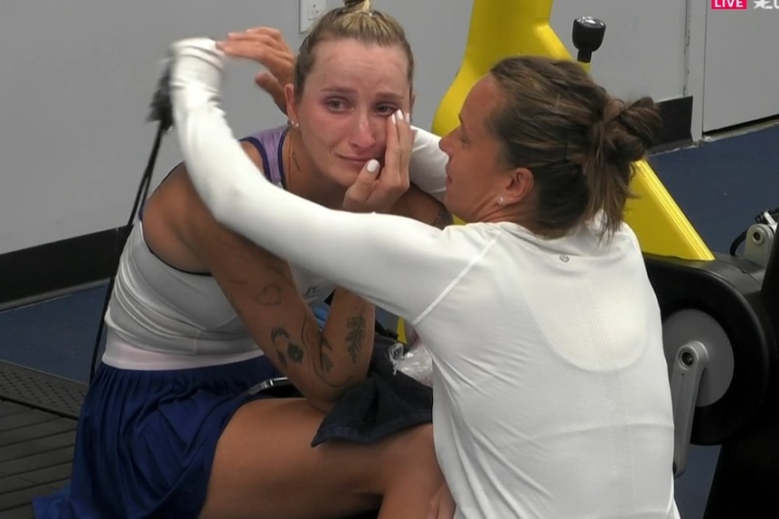 A crying Markéta Vondroušová is hugged by doubles partner Barbora Strýcová after she withdrew from their US Open doubles match.