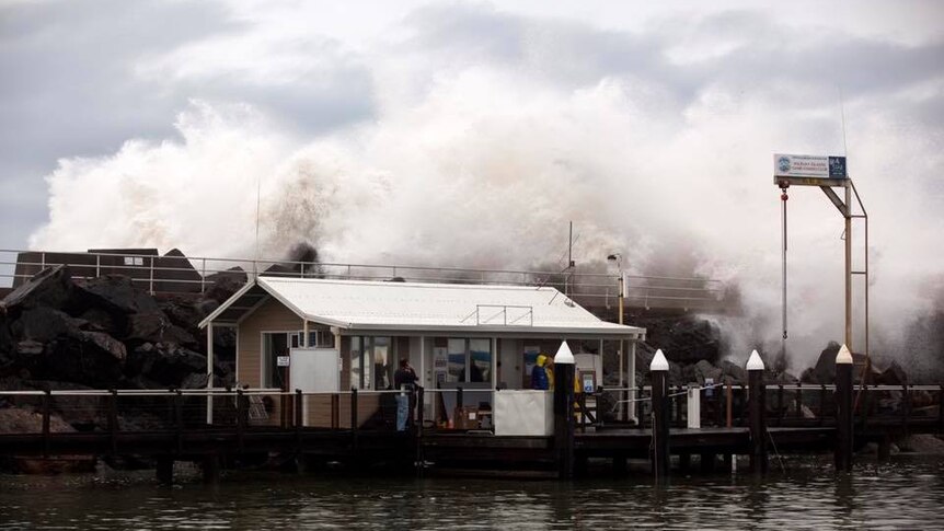 Coffs Harbour marina office being smashed by huge waves