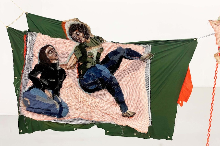Detail from Julia Gutman's entry to the Ramsay Art Prize, where two women made out of fabric sit on a picnic blanket