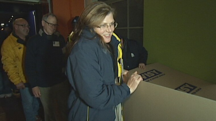 Labor Senator Kate Lundy returns her cardboard box, after the CEO Sleepout in Canberra.