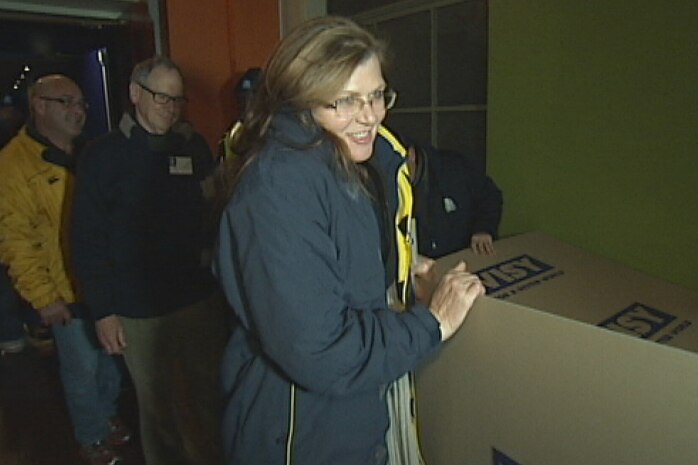 Labor Senator Kate Lundy returns her cardboard box, after the CEO Sleepout in Canberra.