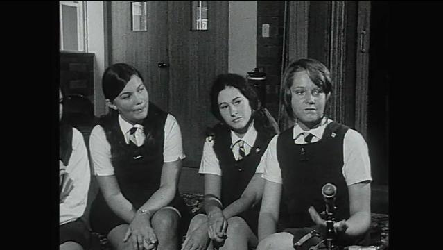 Old photo of three school girls sitting in interview