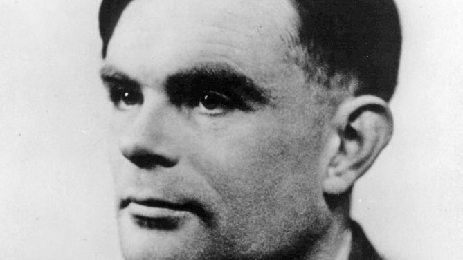 Old black and white head shot of World War II code-breaker Alan Turing.