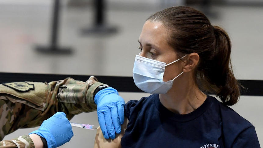 Female firefighter gets a Moderna COVID-19 vaccination in Las Vegas, Nevada.