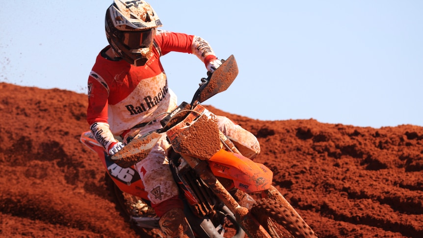A motocross competitor mid-race