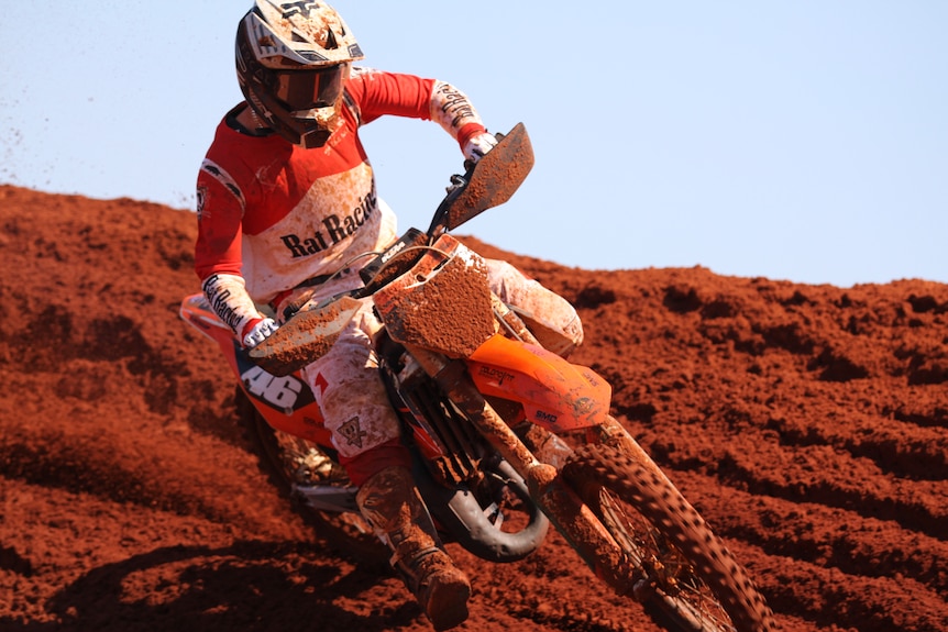 A motocross competitor mid-race