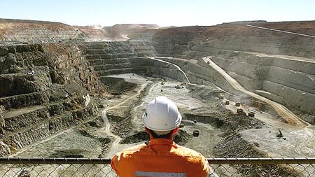 A miner looks across the largest open pit gold min in Australia, the Fimiston Open Pit in Kalgoolie.