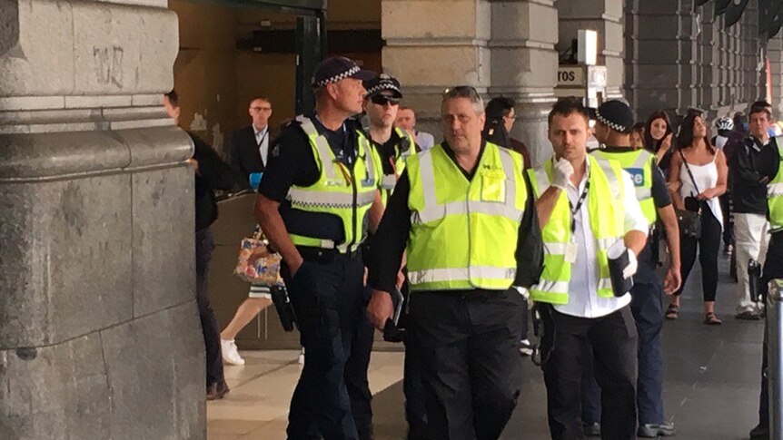 Police clear an area outside Flinders Street Station