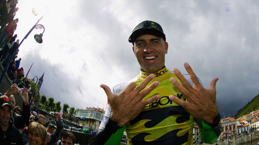 Kelly Slater celebrates his ninth title