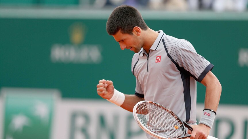 Straight sets ... Novak Djokovic celebrates a point against Fabio Fognini