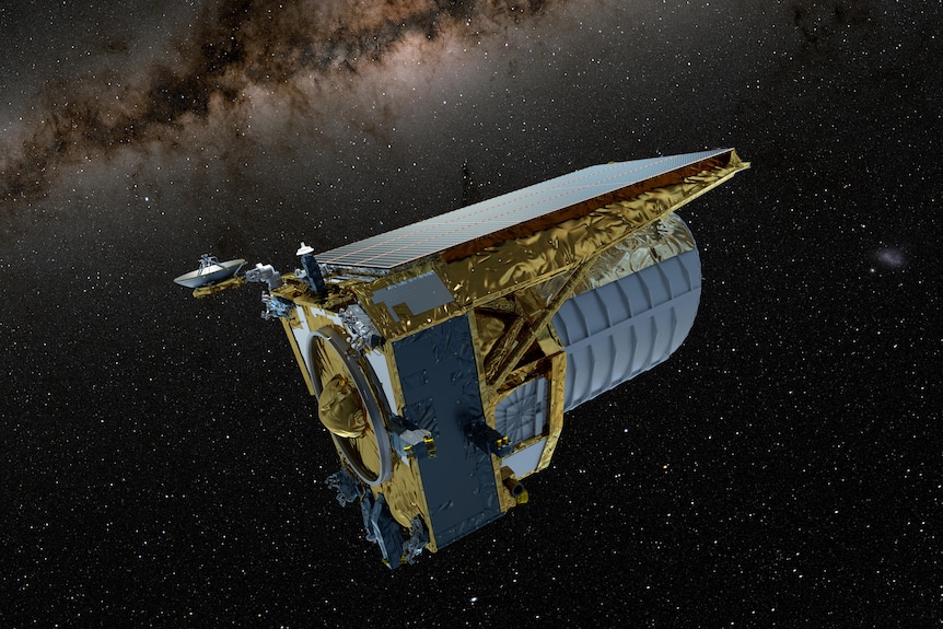 A golden space telescope floats amongst a backdrop of stars and the Milky Way