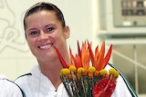 Former Olympic diver Chantelle Newbery with her silver medal and flowers.