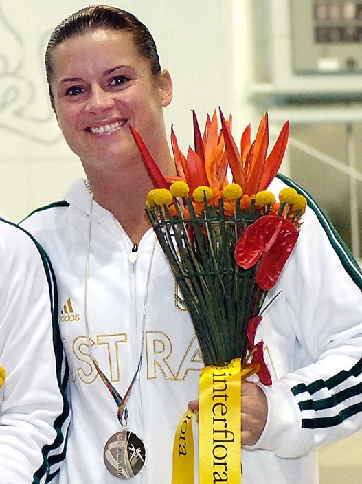 Former Olympic diver Chantelle Newbery with her silver medal and flowers.