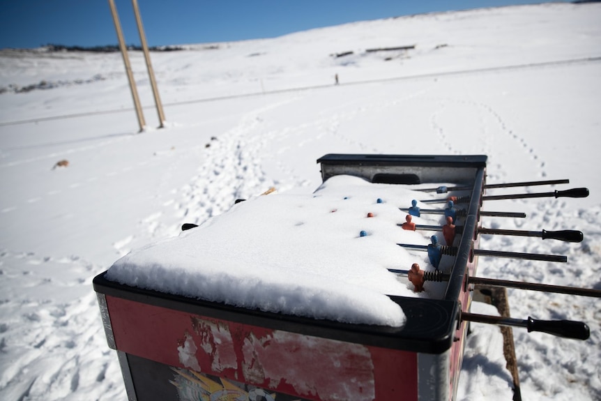 .A foosball table is covered in snow in the Amazigh Timahdite village in the Middle Atlas