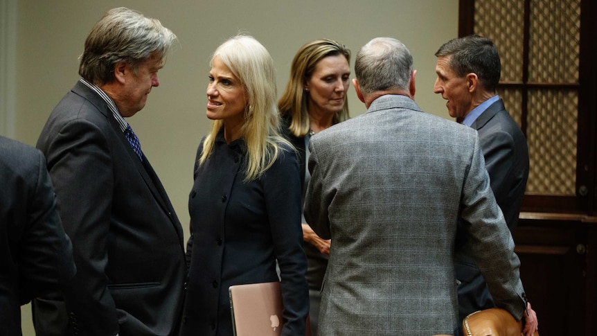 Kellyanne Conway talks to Steve Bannon at the White House.