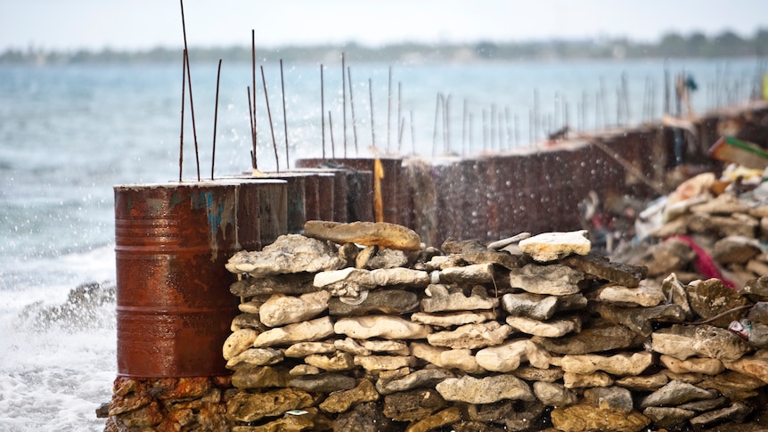 Fuel drums are being used as sea walls to provide protection against coastal erosion in southern Funafuti, Tuvalu.
