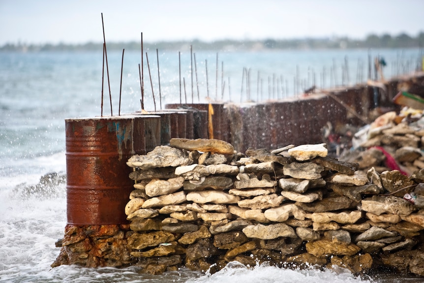 Fuel drums are being used as sea walls to provide protection against coastal erosion in southern Funafuti, Tuvalu.