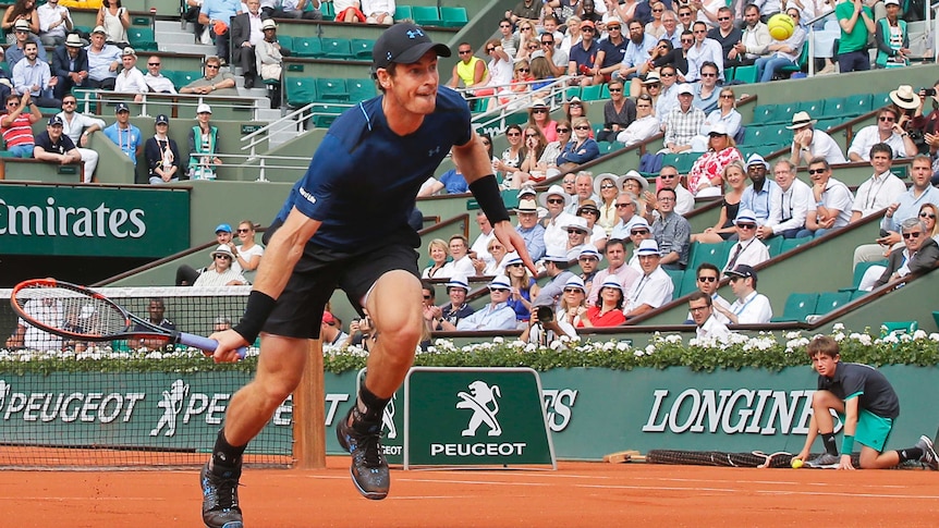 Andy Murray returns a shot against Andrey Kuznetsov at the French Open