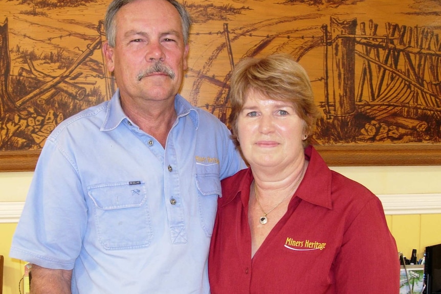 Kim and Kerrie Wilson, Kim with blue button up shirt, brown eyes, short hair, moustache, Kerrie in red Miners Heritage top.