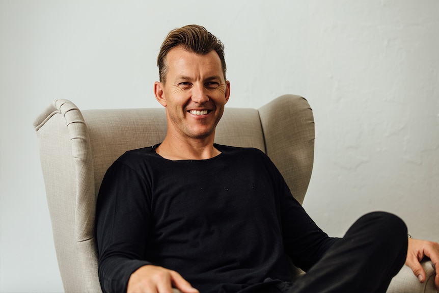 mid shot of cricketer Brett Lee seated and smiling at the camera