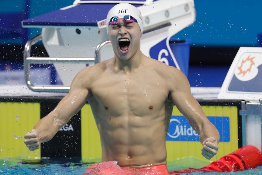 Sun Yang screams and clenches his fist having won the 400m freestyle final.