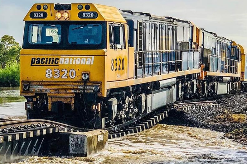 Pacific National train on flooded rail line near Prairie, east of Mount Isa.